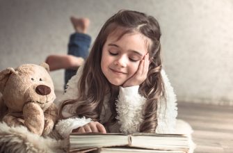 little girl reading book with teddy bear floor concept relaxation friendship 1 - Мрії дитини своїми руками: в Івано-Франківську стартував конкурс із благодійною метою. Відео - rai.ua